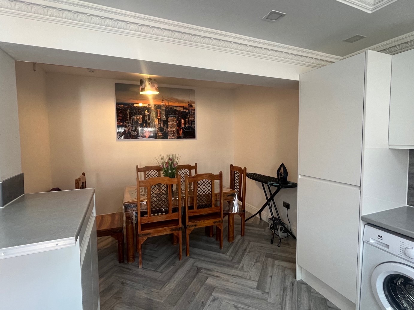 Dining area with a wooden table where meals are shared