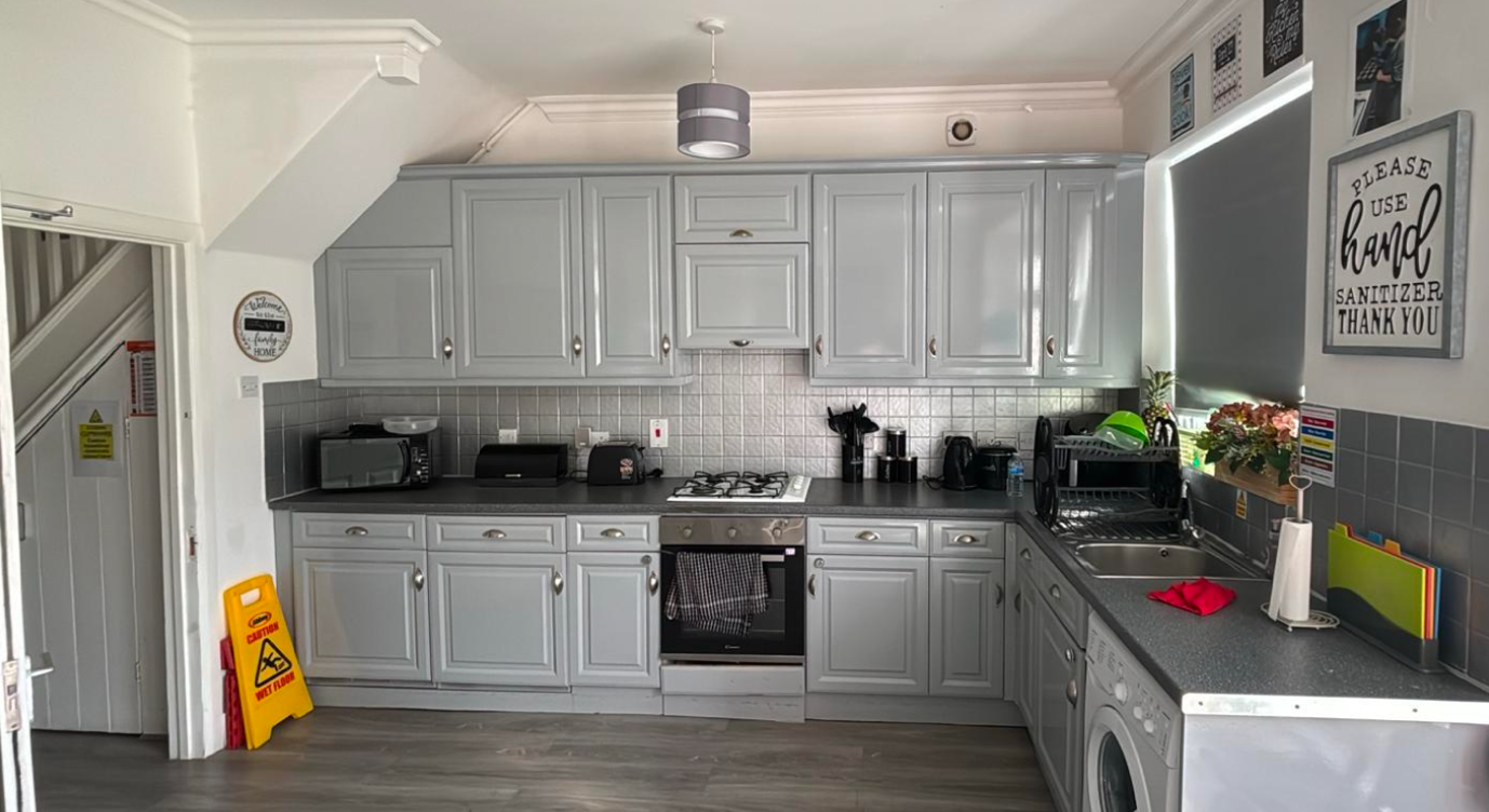Well-equipped family kitchen with grey units